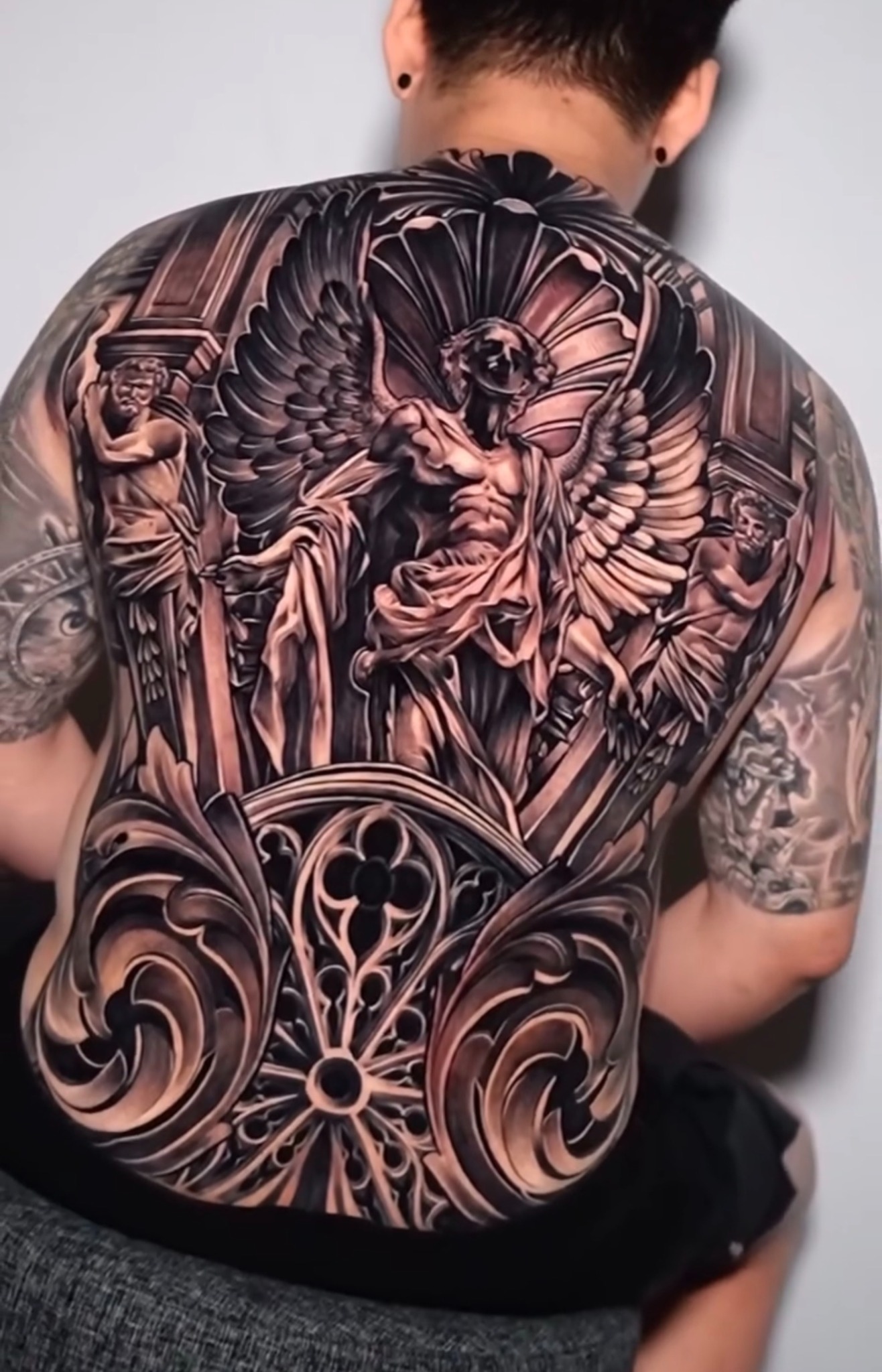 Full back — angel and cathedral ornament